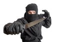 Masked criminal holding a knife Royalty Free Stock Photo