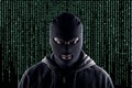 Masked cyber terrorist with black balaclava and hoodie