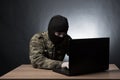 Masked cyber terrorist hacking army intelligence