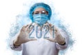 Masked doctor showing the numbers 2021