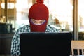 Masked hacker wearing a balaclava stealing information data with laptop. Computer criminal concept. Royalty Free Stock Photo