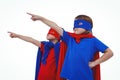 Masked kids pretending to be superheroes