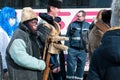 Masked man with a wooden goat on the winter ending Transylvanian traditional carnival