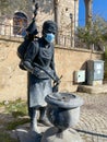 A masked mannequin at the entrance to the store. Turkey