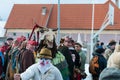 Masked men with his goat on the winter ending Transylvanian traditional carnival