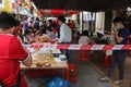 Masked people playing the Chinese Go Game, Weiqi in a street of Georgetown