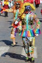 Masked Peruvian dancer in traditional dress at the annual Fiesta del Cusco, 2019