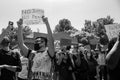 Masked protestors chant and hold signs in protest of the killing of George Floyd Royalty Free Stock Photo