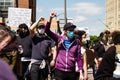 Masked Protestors Raise Fists at Protest for George Floyd