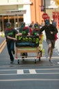 Masked Team Races A Bed In Quirky Fundraiser Race