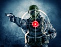 Masked terrorist man with gun and laser target on his body Royalty Free Stock Photo