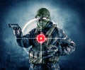 Masked terrorist man with gun and laser target on his body Royalty Free Stock Photo