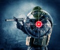 Masked terrorist man with gun and laser target on his body Royalty Free Stock Photo