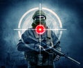 Masked terrorist man with gun and laser target on his body Royalty Free Stock Photo