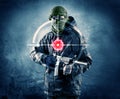 Masked terrorist man with gun and laser target on his body Royalty Free Stock Photo