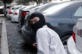 Masked thief in black balaclava trying to break into car. Criminal crime concept Royalty Free Stock Photo