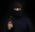 Masked thief with gun Royalty Free Stock Photo