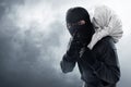 Masked thief steal on smoke background Royalty Free Stock Photo