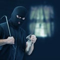 Masked thief stealing jewelry Royalty Free Stock Photo