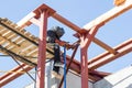 Masked welder welds metal at a construction site Royalty Free Stock Photo