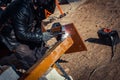 Masked welder welds metal at a construction site