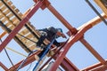 Masked welder welds metal at a construction site Royalty Free Stock Photo