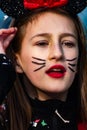 masked woman dressed as Minnie in a parade on the streets of ScorzÃâ in the province of Venice.