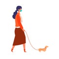 Masked woman walk her dog at autumn. Woman have a relaxing day off on new normal