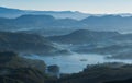 Maskeliya reservour morning foggy view from Adam`s Peak 2243 m mountain located in central Sri Lanka - Sacred Mountain for four