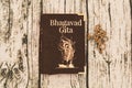 Maski,Karnataka,India - DECEMBER 29,2018 : Holy Bhagavad gita with wooden textured background