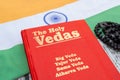 Maski,Karnataka,India - March 13,2019 :The Holy Vedas on wooden textured background with Indian flag.