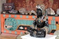 Mexican masks and obsidian statue in souvenir store