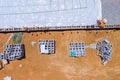 A mason bricklayer worker is laying the mounting a wall of aerated concrete blocks for building Royalty Free Stock Photo