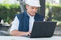 Mason builder using compaq brand laptop Royalty Free Stock Photo