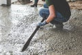 Mason building a screed coat cement