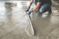 Mason building a screed coat cement Royalty Free Stock Photo