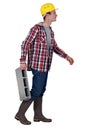 Mason carrying breeze block Royalty Free Stock Photo