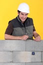 A mason checking his wall Royalty Free Stock Photo