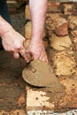 Mason hands at bricklaying works