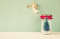 mason jar with christmas tree and flying angel