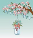 Mason jar with flower hanging in tree branch Royalty Free Stock Photo