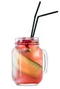 Mason jar with fresh cold pink lemonade with cucumber, cranberries and black straws isolated on white background