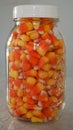 Mason jar full of candy corn on the counter Royalty Free Stock Photo