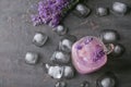 Mason jar with lavender lemonade and ice cubes on grey background Royalty Free Stock Photo