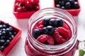 Mason jar with tasty berry smoothie, closeup