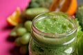 Mason jar of tasty green smoothie, closeup