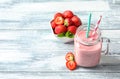 Mason jar with tasty strawberry smoothie