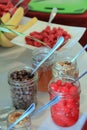 Mason jars filled with toppings for ice cream sundaes