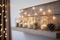 mason jars with led fairy lights inside, arranged on a wooden shelf