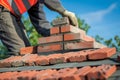 mason laying bricks for a rooftop chimney stack Royalty Free Stock Photo